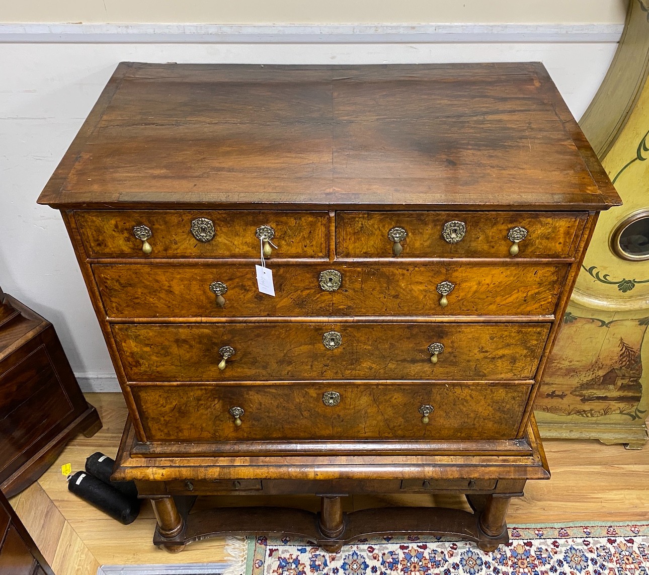 An 18th century walnut chest on stand, width 106cm, depth 61cm, height 127cm